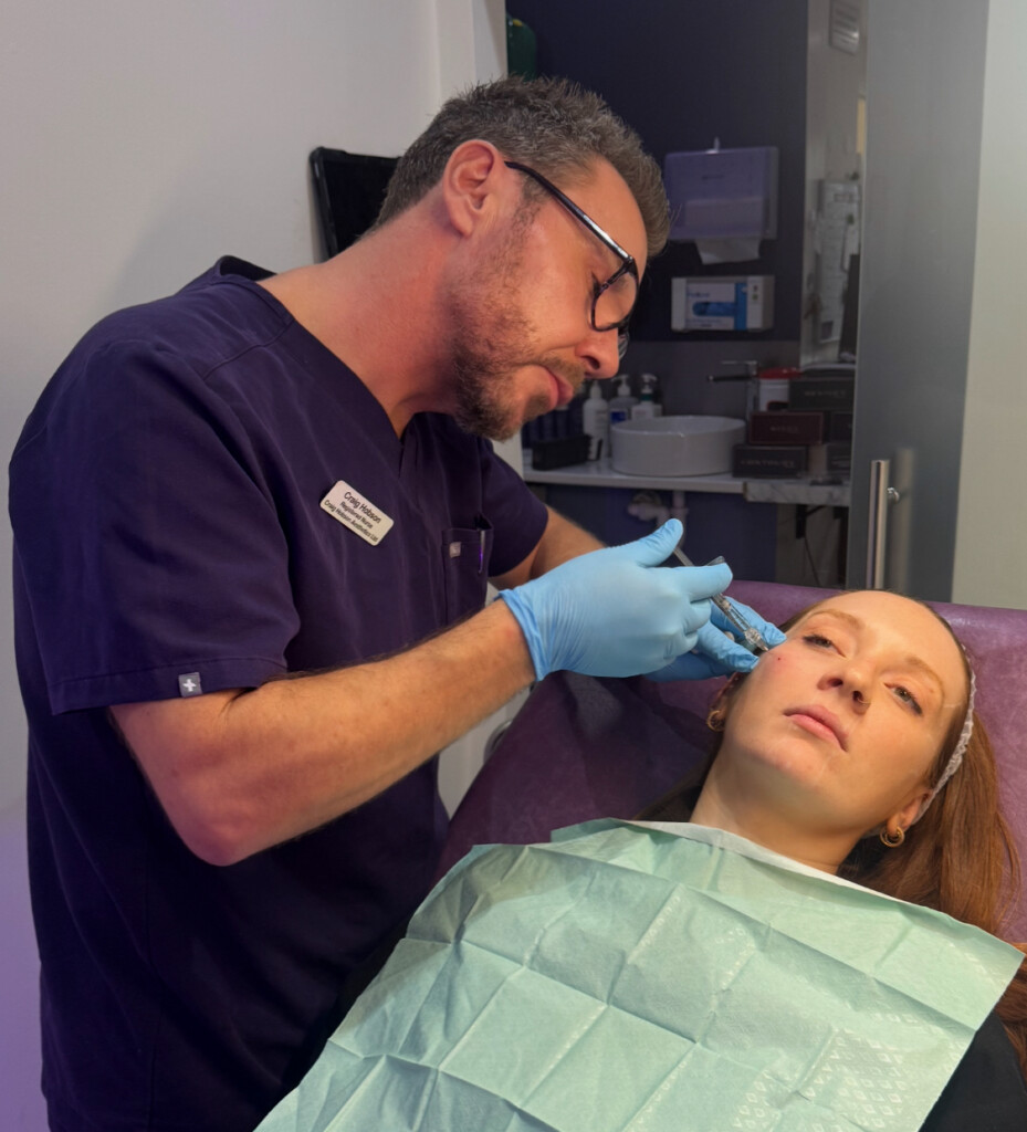 Craig Hobson administering an injectable treatment