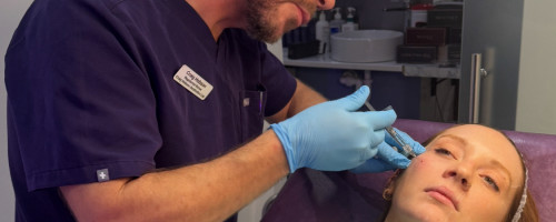 Craig Hobson administering an injectable treatment